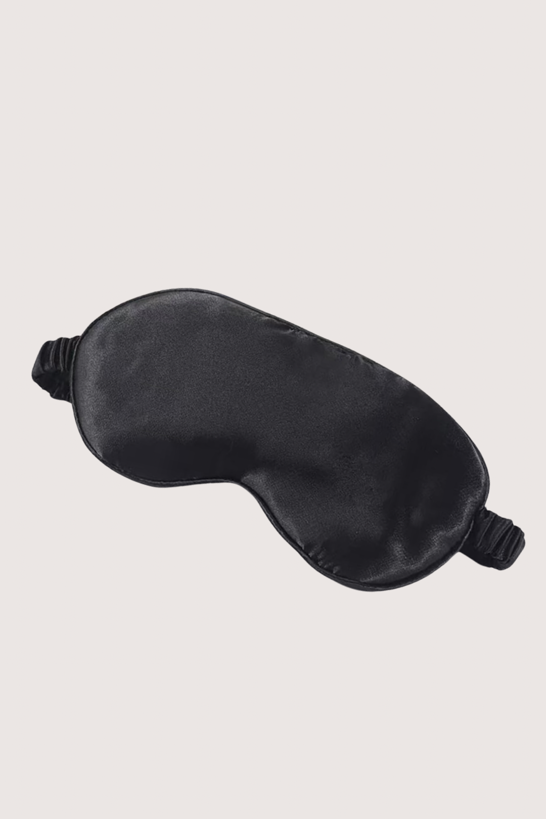Black satin eye mask on a light gray background
